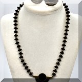 J080. Sterling silver and black onyx necklace with matching sterling silver and black onyx round earrings. - $68 